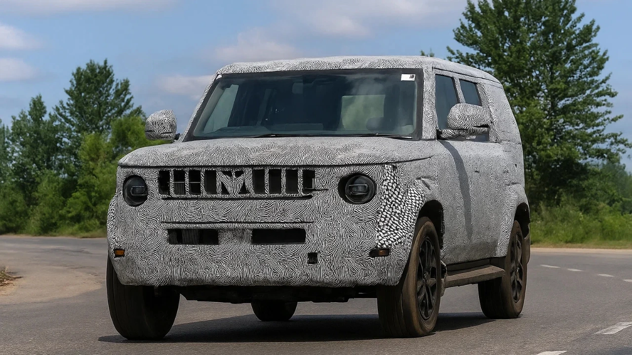 Spy shot of the heavily camouflaged 2025 Mahindra Bolero Neo Facelift undergoing road testing, showcasing its new design language and robust SUV stance.