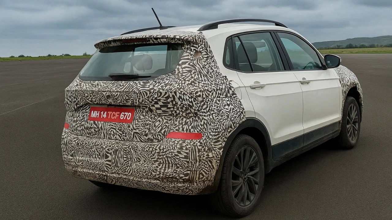 Volkswagen Taigun facelift rear view test mule in camouflage, showcasing new taillight and bumper design.